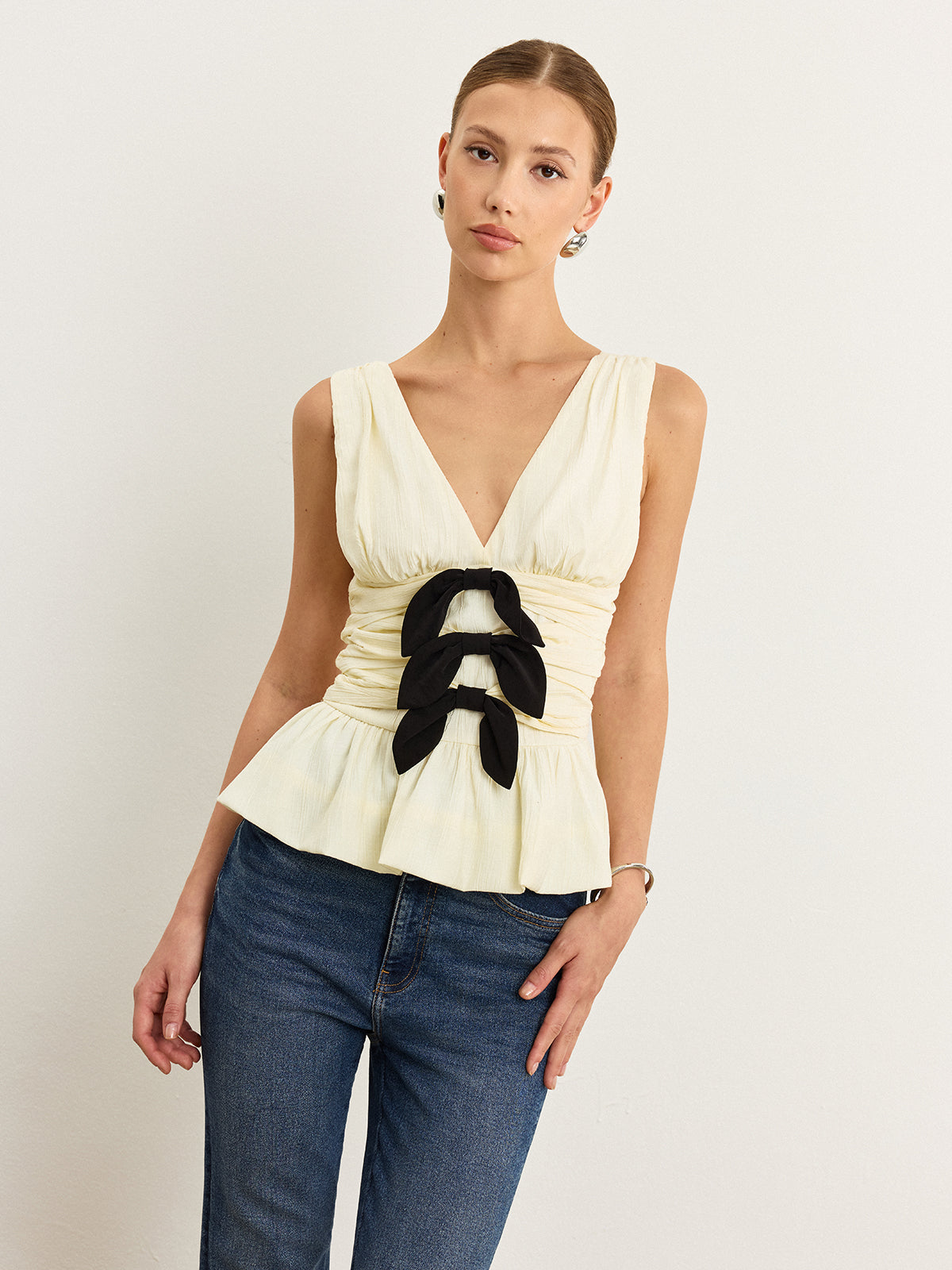 Bow-Detail Ruched Top with Peplum Hem