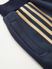 Quadruple Stripe Sweatpants